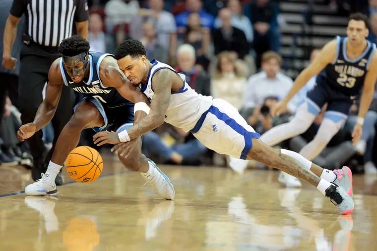 T.J. Bamba, left, of Villanova and Al-Amir Dawes of Seton Hall dive for the ball during the 2nd half on March 6, 2024 at the Prudential Center in Newark, N.J. T.J. Bamba, left, of Villanova and Al-Amir Dawes of Seton Hall dive for the ball during the 2nd half on March 6, 2024 at the Prudential Center in Newark, N.J.