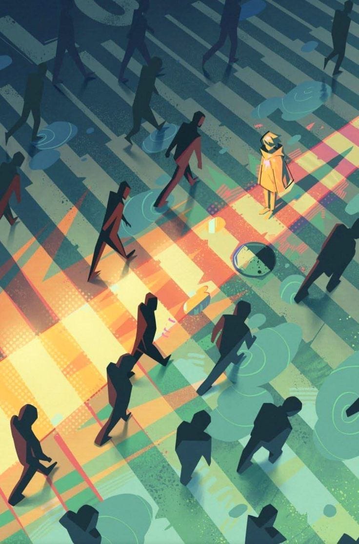 This may contain: a group of people walking across a crosswalk in the middle of a city at night