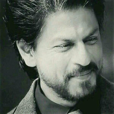 Shah Rukh Khan - the sexiest man alive. Big nose, dramatic eyebrows, dimples, and a six-pack at 58.