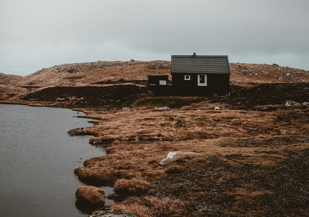 black house in the middle on island black house in the middle on island