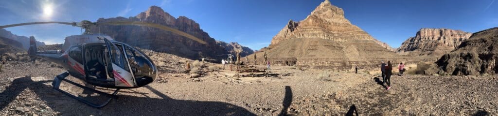 A helicopter sits on a rocky landing pad in the Grand Canyon, ready to whisk visitors away. A happy life and a meaningful life are not the same thing, but this view offers both! A helicopter sits on a rocky landing pad in the Grand Canyon, ready to whisk visitors away. A happy life and a meaningful life are not the same thing, but this view offers both!