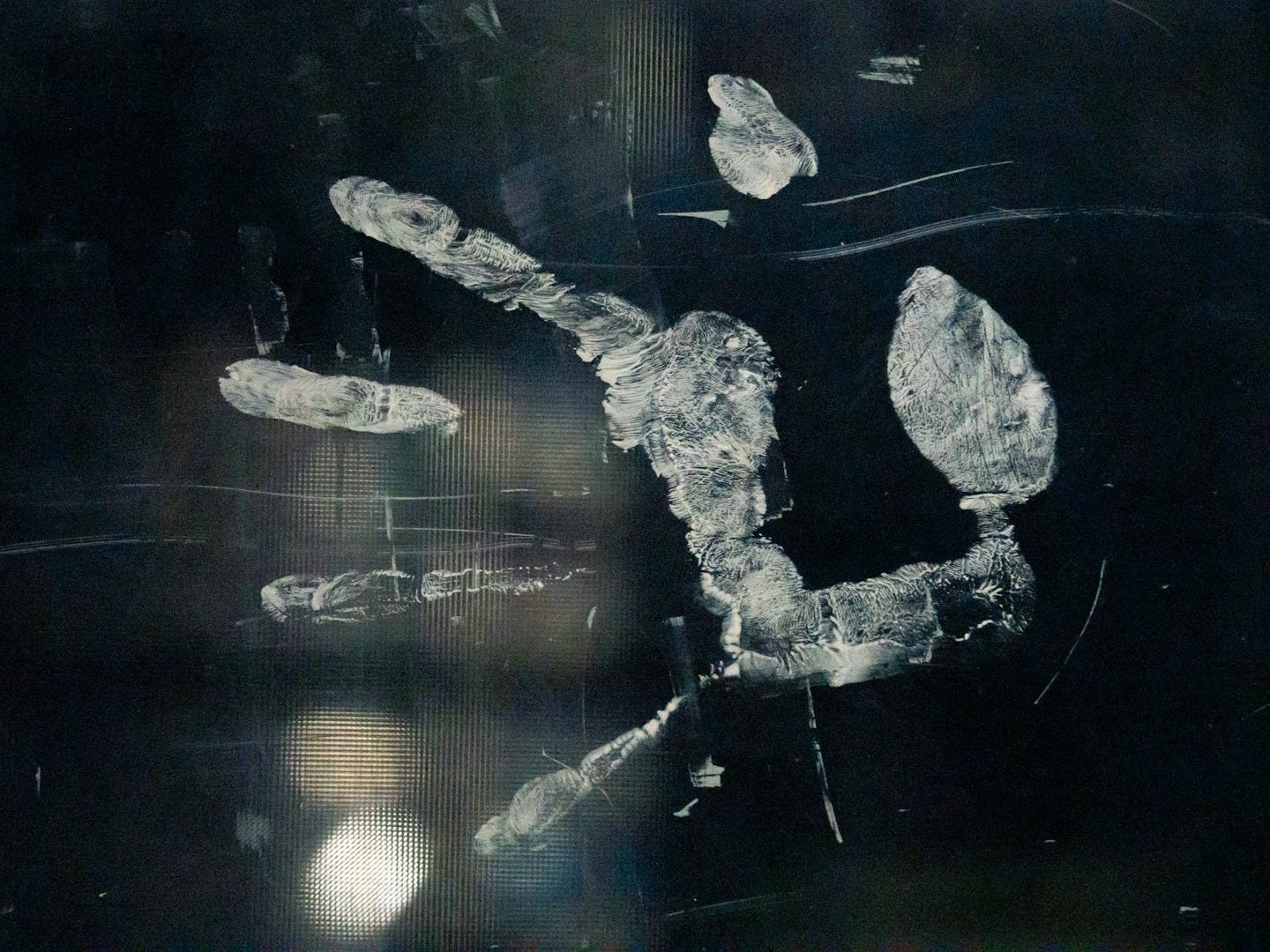 a black and white photo of a person's hand and foot