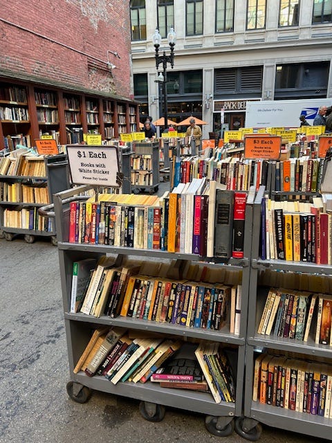 Rolling carts full of books outside Brattle Book Shop