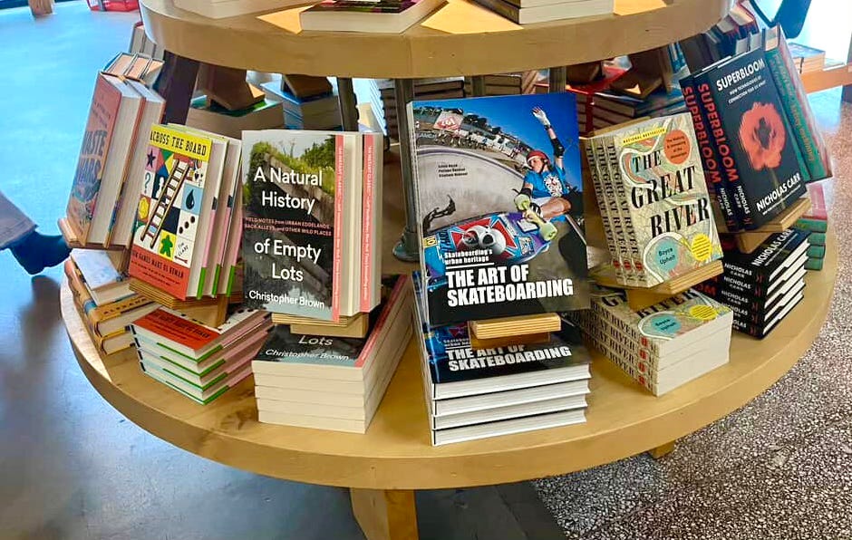 Books including A Natural History of Empty Lots on bookstore shelf