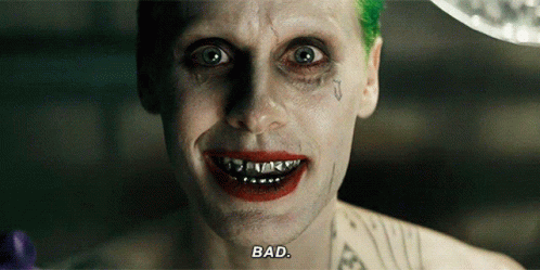 a close up of the joker 's face with the words bad written on the bottom
