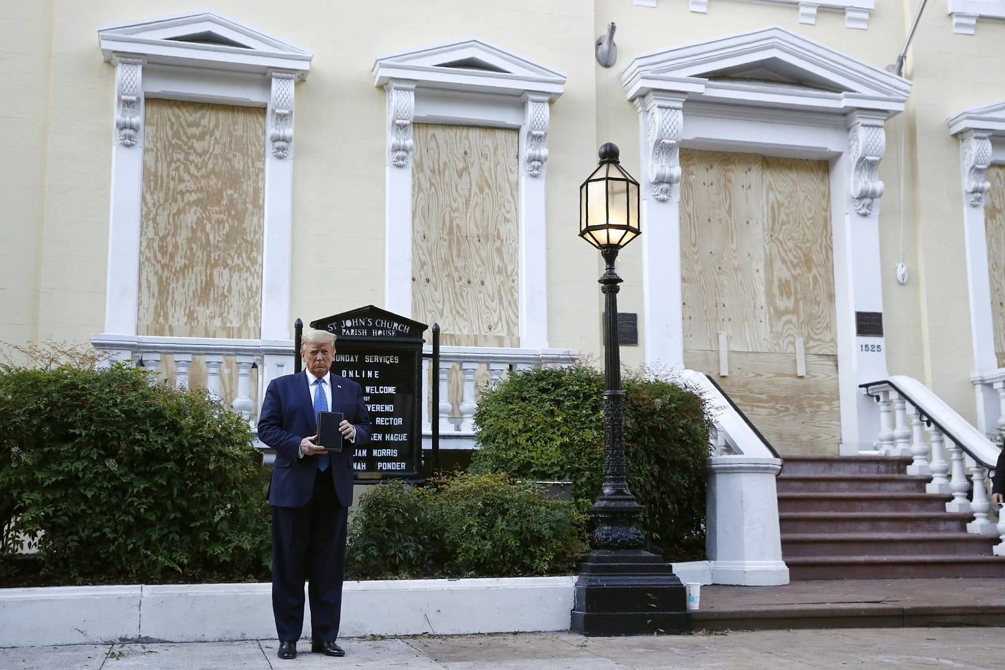 AP photo of Donald Trump standing awkwardly in front of the boarded-up windows of St. John's Church, holding a black Bible awkwardly in his tiny hands. AP photo of Donald Trump standing awkwardly in front of the boarded-up windows of St. John's Church, holding a black Bible awkwardly in his tiny hands.