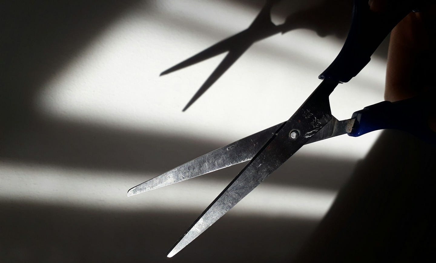 black handle scissors on white surface black handle scissors on white surface