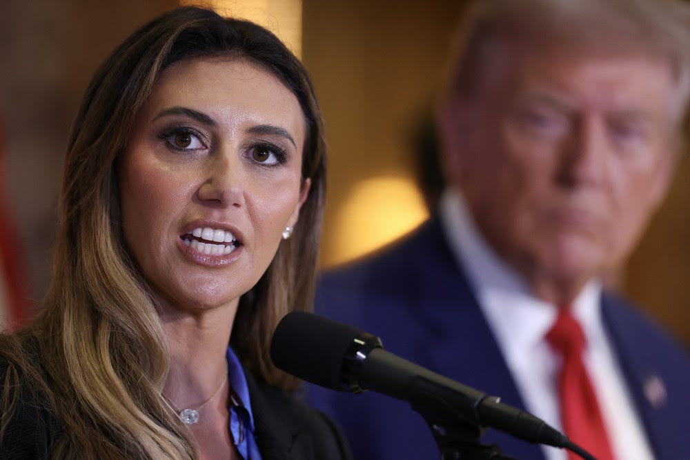 Alina Habba speaks as Donald Trump looks on during a press conference at Trump Tower.