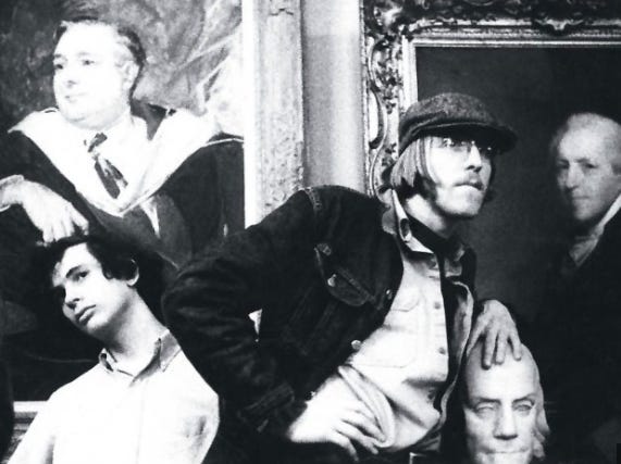 A group of men posing for a picture

AI-generated content may be incorrect.