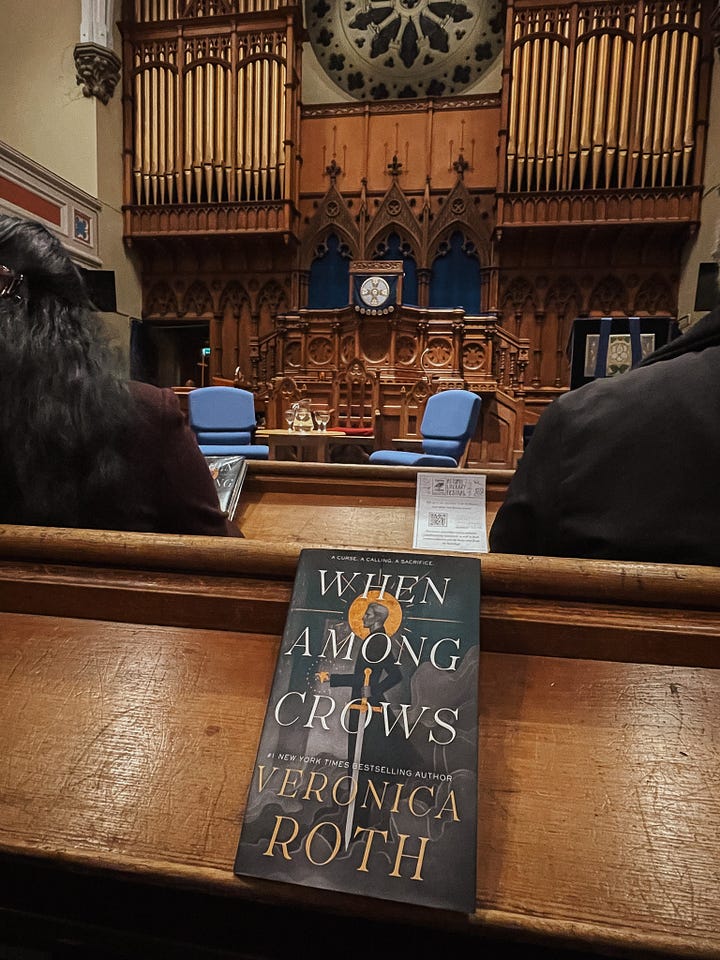 Image 1: Book event for When Among Crows by Veronica Roth in a church setting, with the book cover visible. / Image 2: M. L. Rio speaking with a Topping's bookseller at a book event for Graveyard Shift.