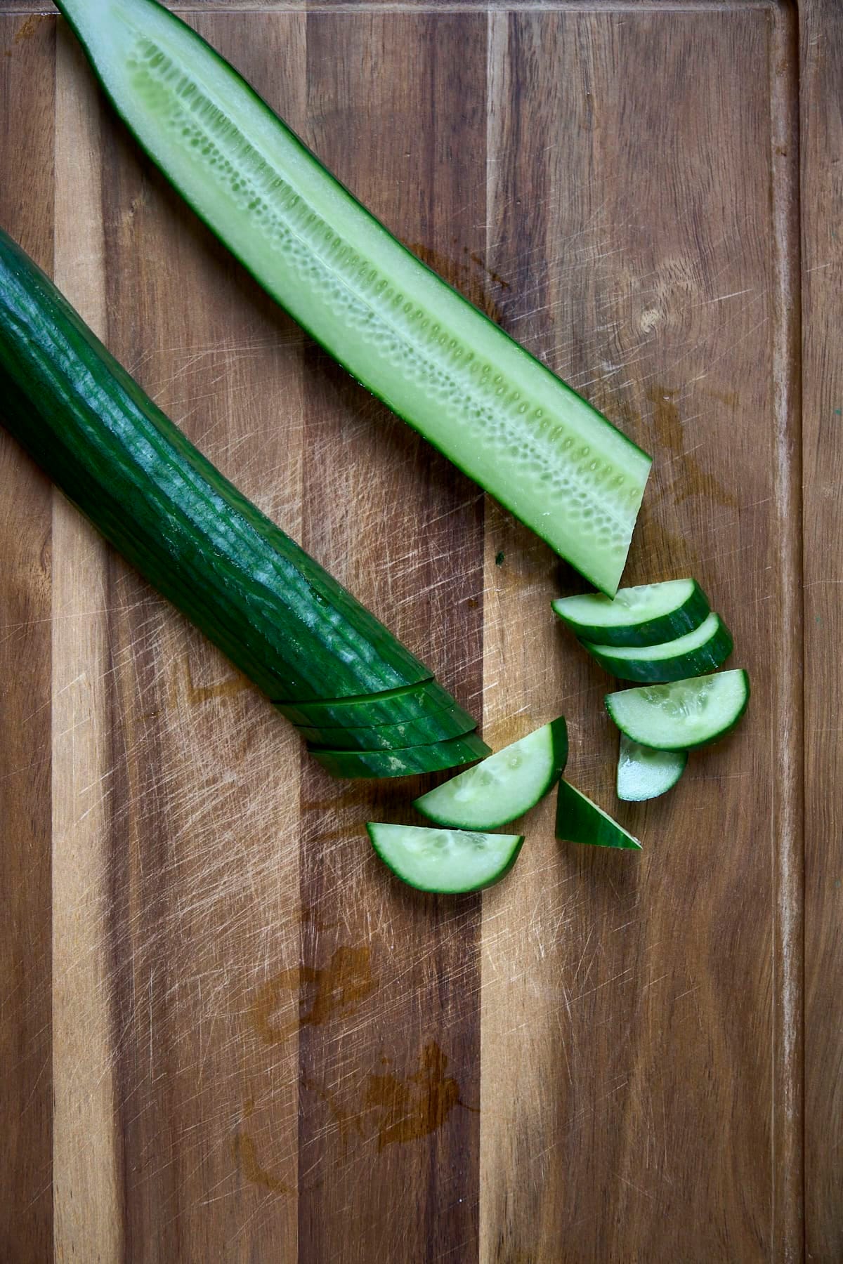slicing English cucumbers for korean cucumber salad