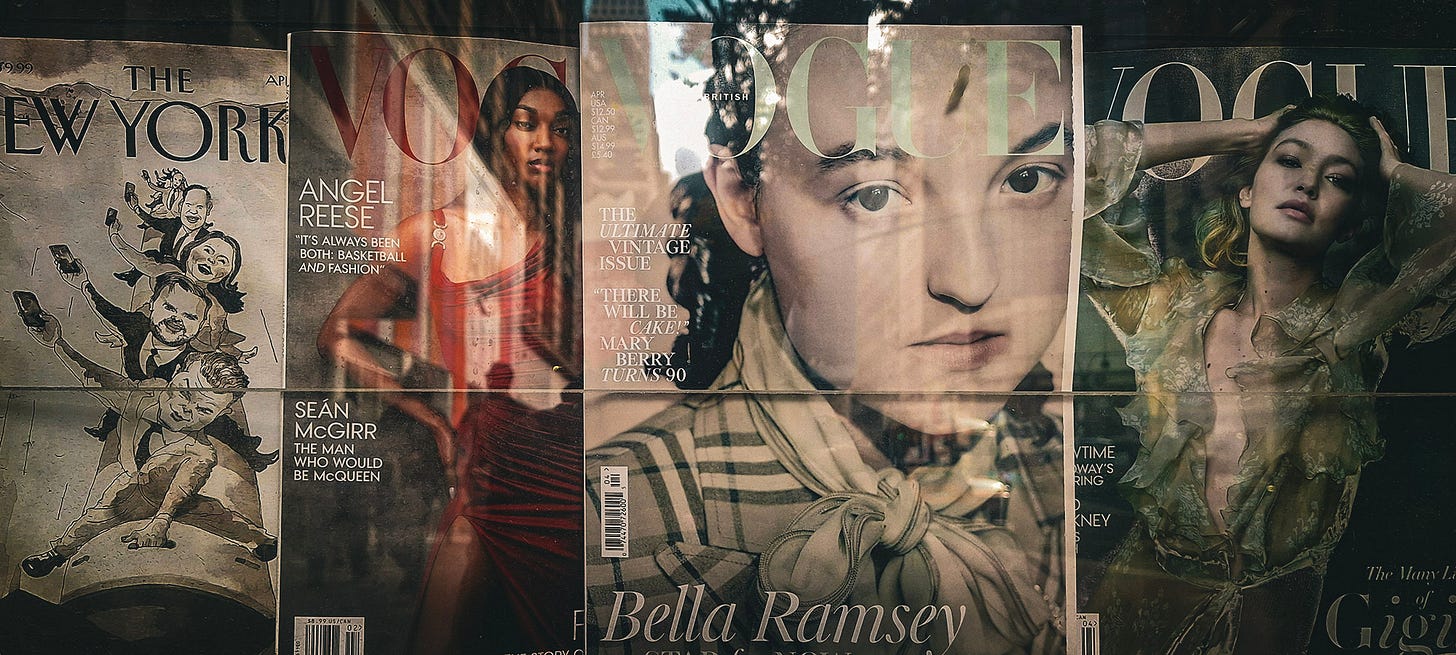 Magazines for sale in stall on a NYC street.