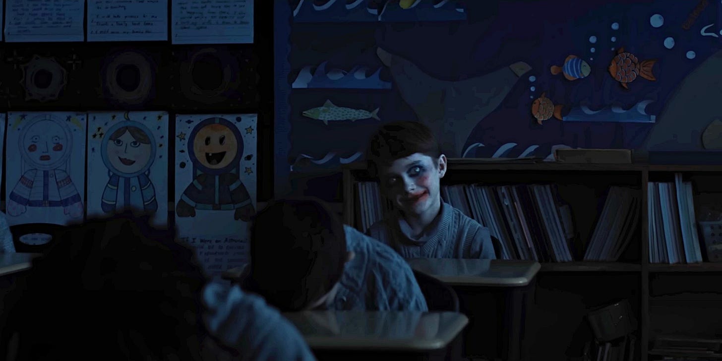 Weapons (2025) - Alex stares creepily at the camera.