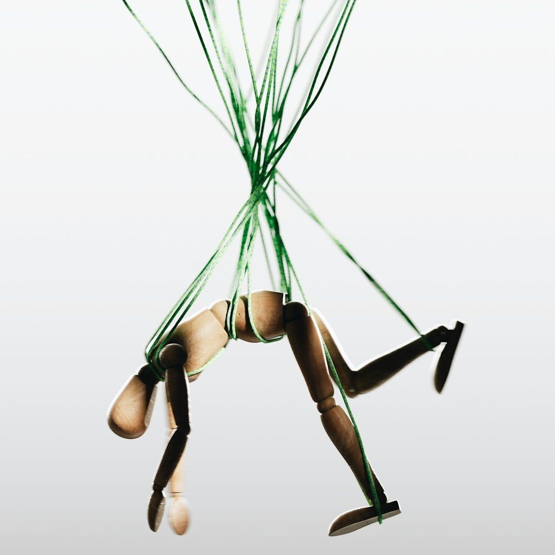 a woman in a tight bodysuit is suspended in the air