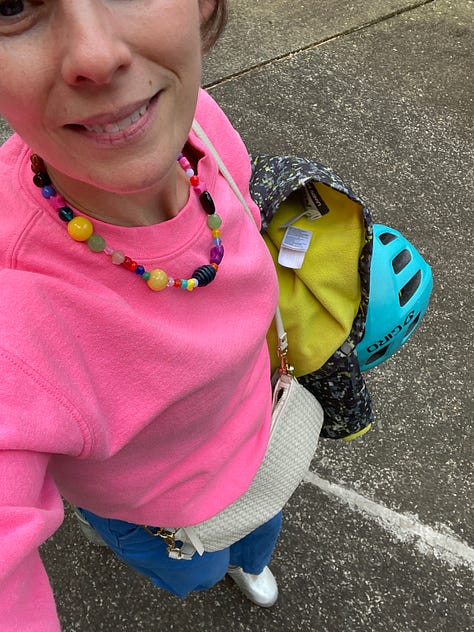 lilac, cherry blossom, calla lily, forest, dandelion in situ; kelly in hot pink sweatshirt and multi-colored necklace
