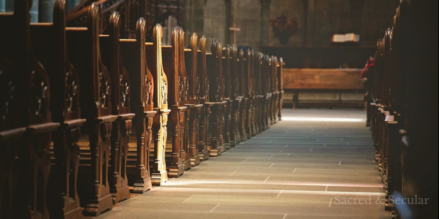 A dimly lit church interior divided by a shaft of light crossing through the space, creating a visual contrast between brightness and shadow and symbolising separation, tension, and the possibility of reconciliation. A dimly lit church interior divided by a shaft of light crossing through the space, creating a visual contrast between brightness and shadow and symbolising separation, tension, and the possibility of reconciliation.