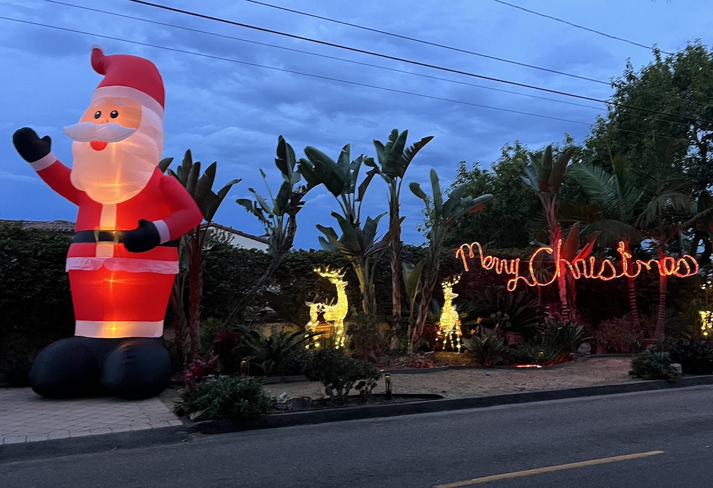 Dozens of residents along Highland Drive and Olde Carlsbad are spreading holiday cheer with massive inflatable Santas. Anya Keast photo