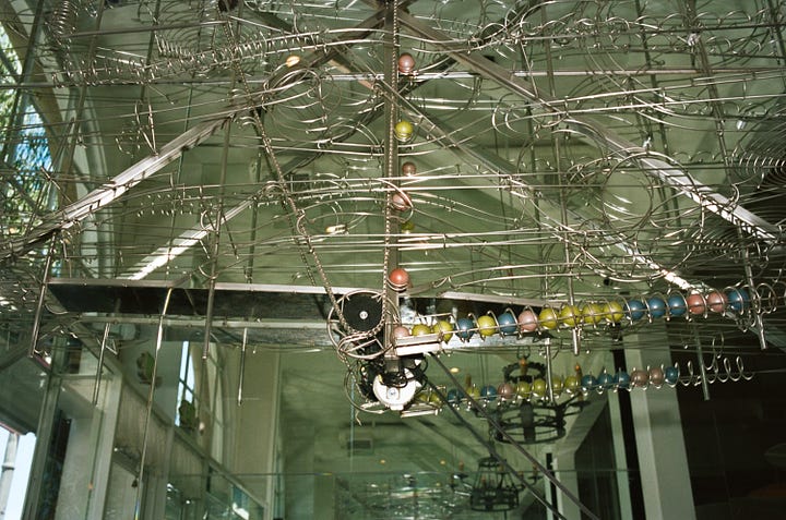 Matthew Gaulden's rolling ball sculpture and Nick Poe's Saturn lamp.