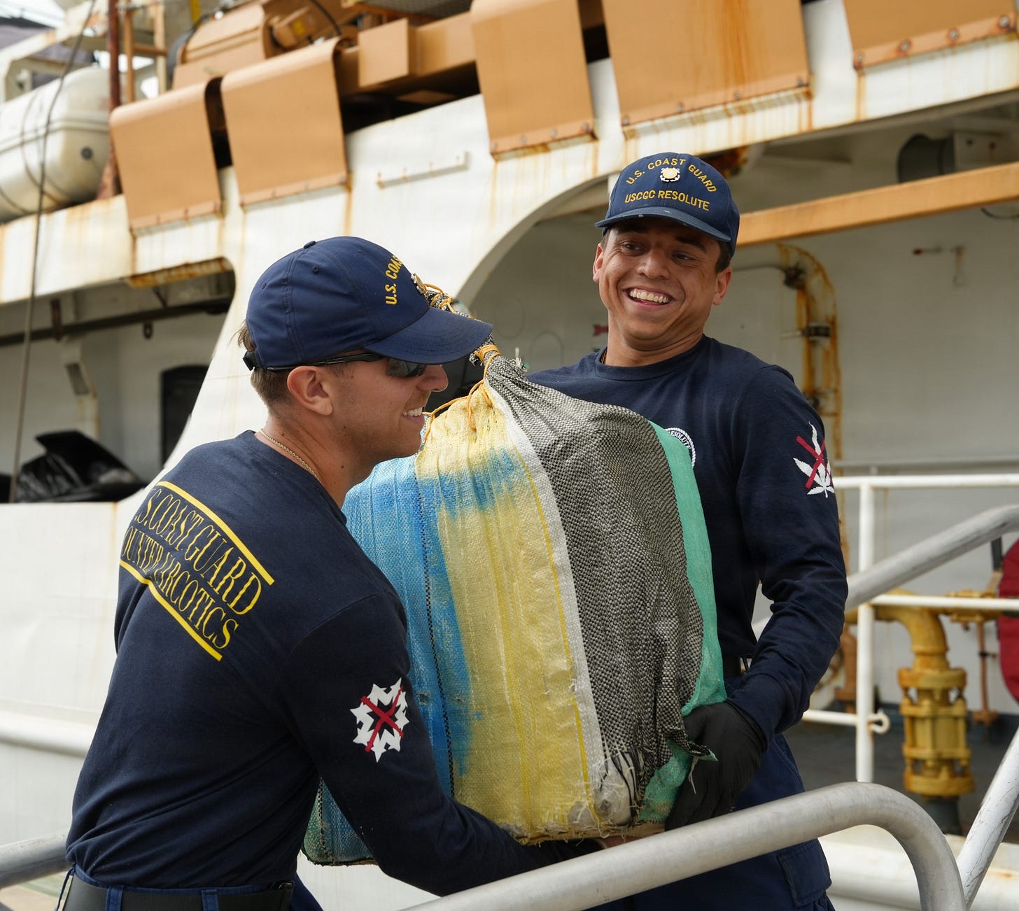 Coast Guardsmen assigned to the Cutter Resolute offload a portion of a 2,570-pound cocaine seizure in Miami Beach, Florida. (US Coast Guard photo)