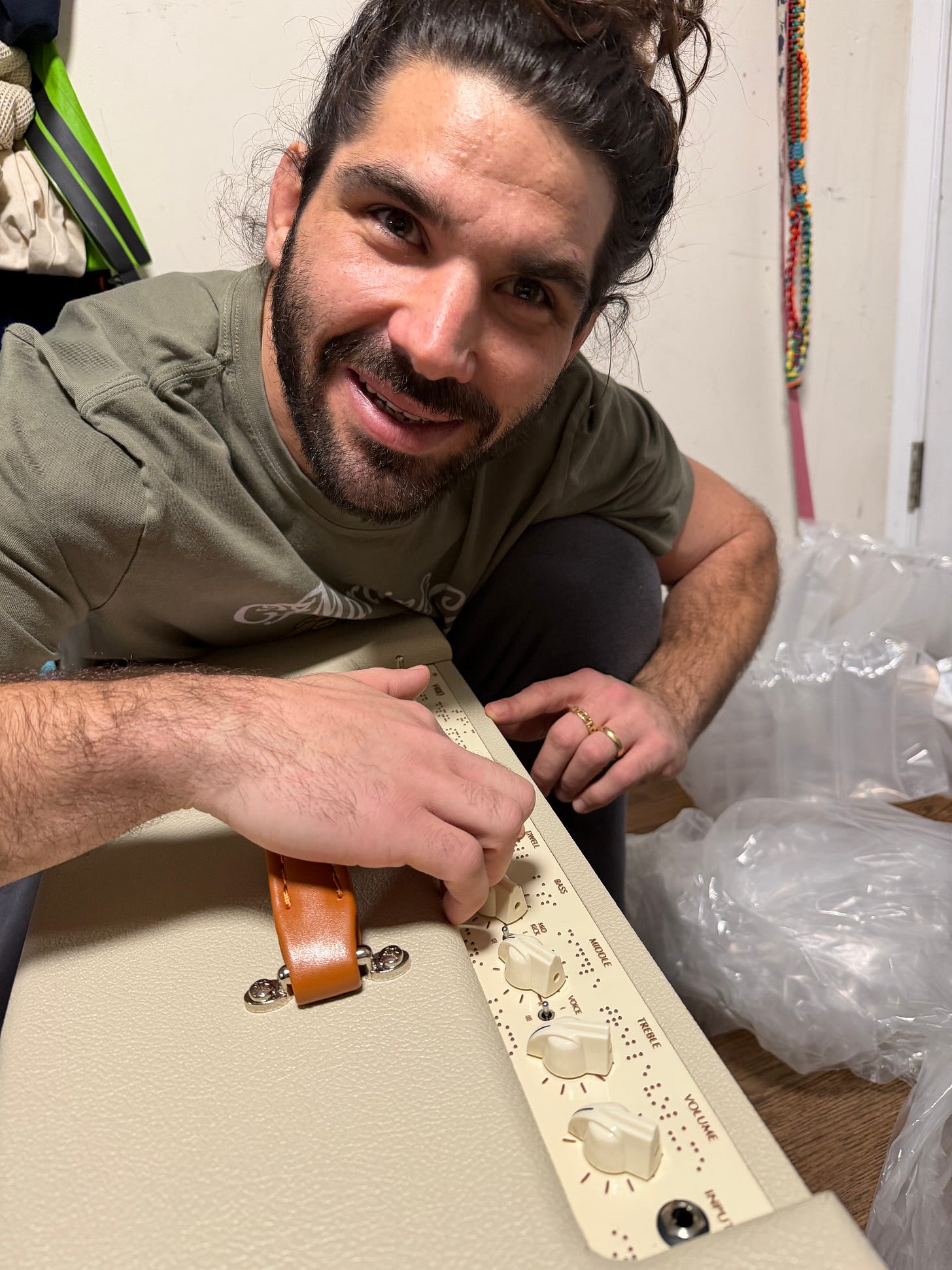 anthony with a huge smile on his face as he poses with his brand new Braille Victory Amp