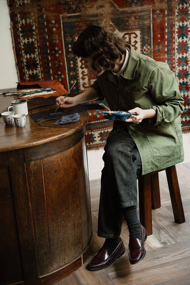 Farah Alimi painting on leather pieces at Paramaz in Paris