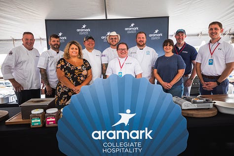 “Chefs from Aramark Collegiate Hospitality showcasing coastal-inspired dishes at the NC Seafood Festival 2025 — including seafood risotto, crab gumbo, and fried shrimp tacos — during live cooking demos and tastings with festival guests.”