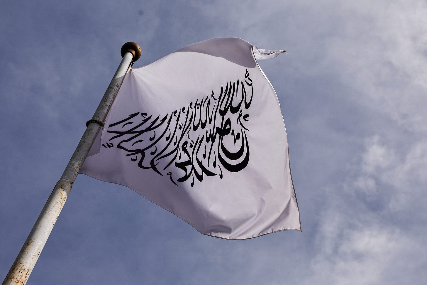 Flag of the Islamic Emirate of Afghanistan flutters at the Embassy of Afghanistan in Beijing