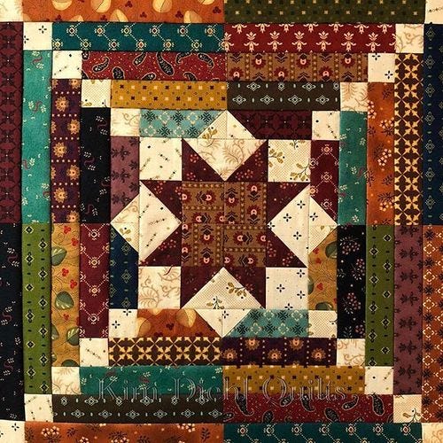a patchwork quilt with many different colors and designs on the front, along with an intricately designed border