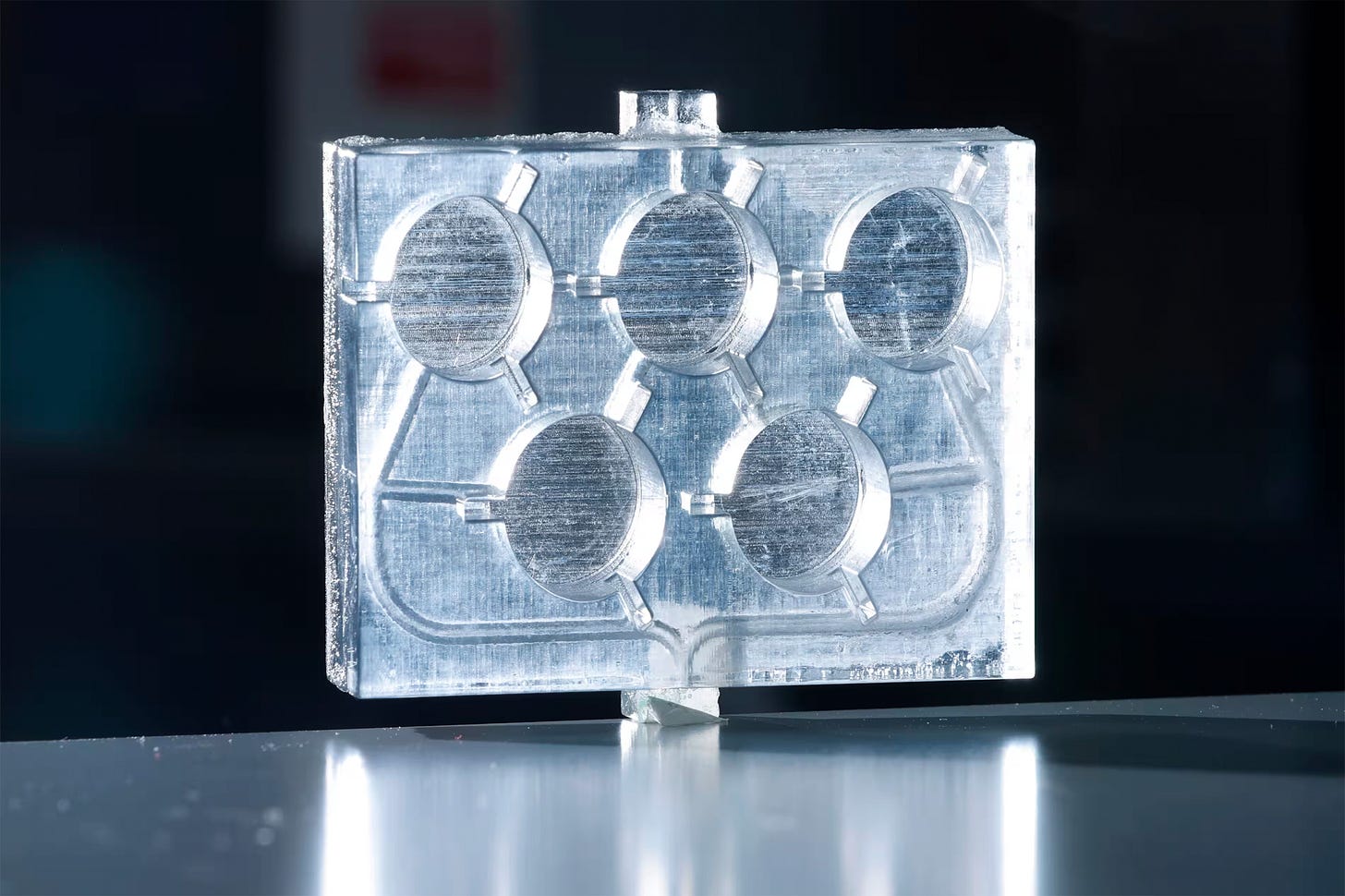 A glass-appearing rectangle with 5 interlocking circles.