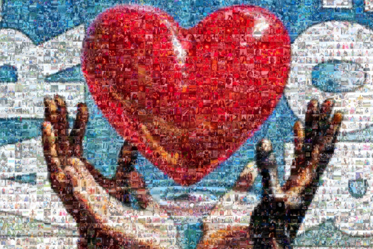 A large photo mosaic mural composed of thousands of individual photographs forms the image of hands lifting a heart. Each small image represents a separate community contribution.