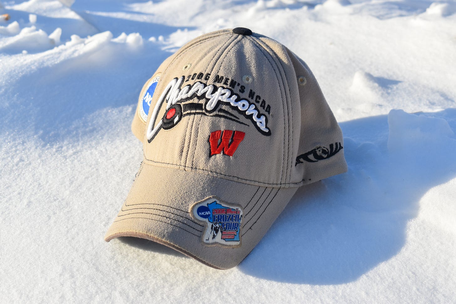 Wisconsin men's hockey hat in the snow
