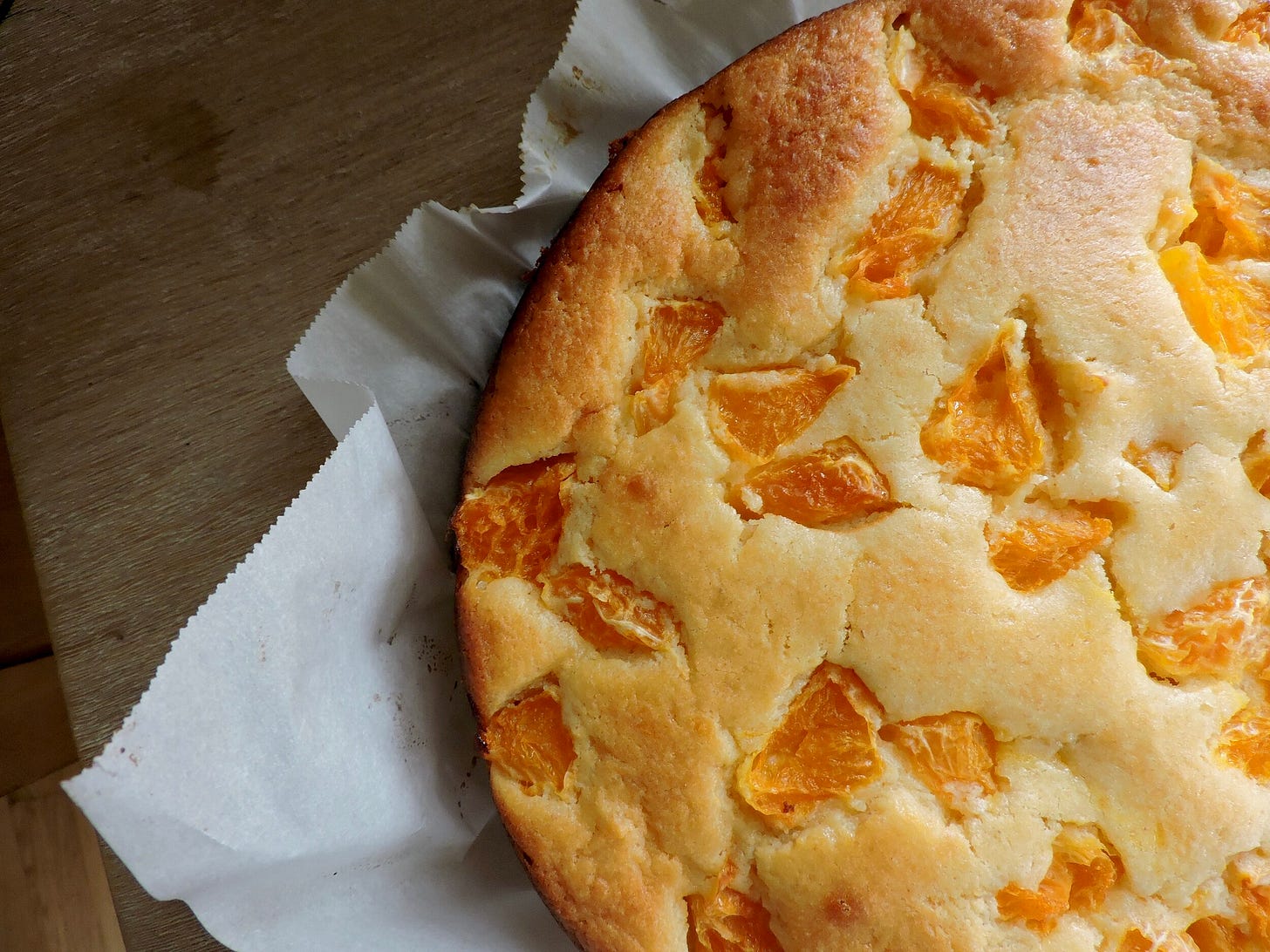   Bitter Tangerine Goat:  Swap in 1/2 cup of goat cheese for an equal part of the ricotta and use chopped tangerines for the fruit. The goat cheese adds a lovely depth to the cake, preserves the rich creaminess, and isn’t overwhelming. It’s flavor is just barely perceptible which contrasts nicely with the citrus. You could easily add more if you want a more dominant flavor. Chopped tangerines (and oranges in general) get bitter when baked, their membranes packing a punch like a grapefruit (even while their insides remain sweet and juicy). My husband loves the bitterness, but it isn’t for everyone. 