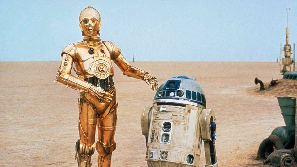 In George Lucas' Krieg der Sterne (1977) hatte der Droide C-3PO neben R2-D2 seinen ersten Auftritt. In George Lucas' Krieg der Sterne (1977) hatte der Droide C-3PO neben R2-D2 seinen ersten Auftritt.