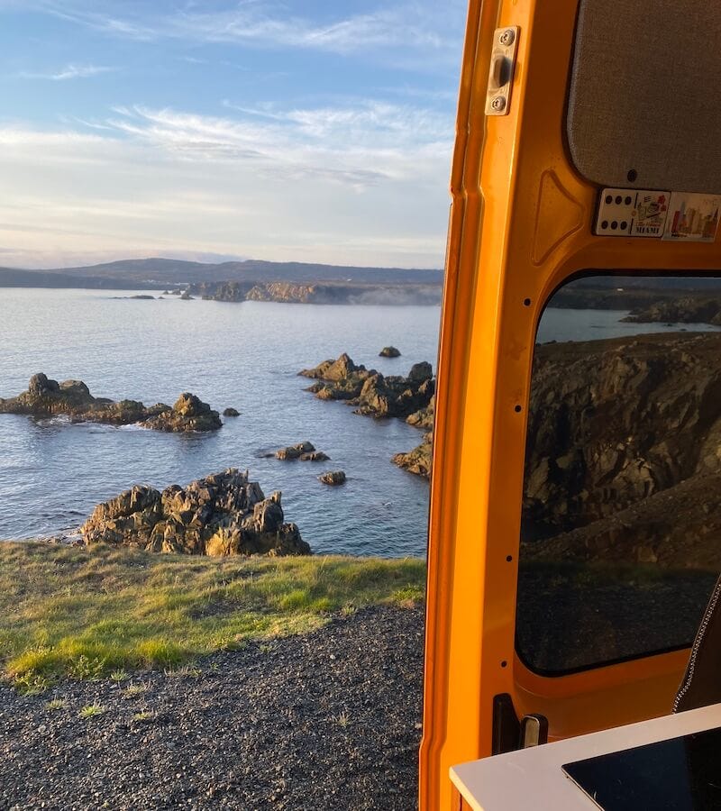 The view out of our converted camper van's door in Bonavista Nefoundland while parked along an ocean cliff The view out of our converted camper van's door in Bonavista Nefoundland while parked along an ocean cliff