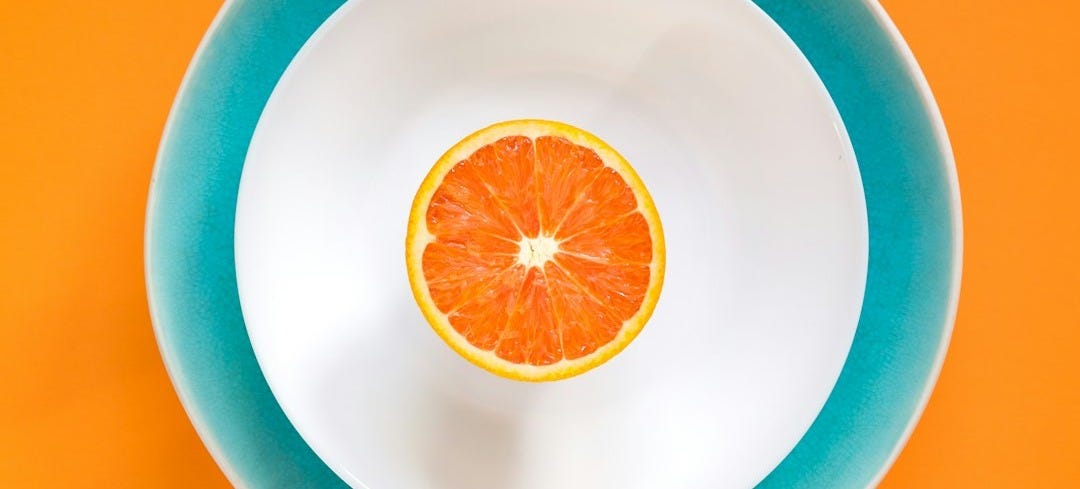 sliced orange fruit in bowl