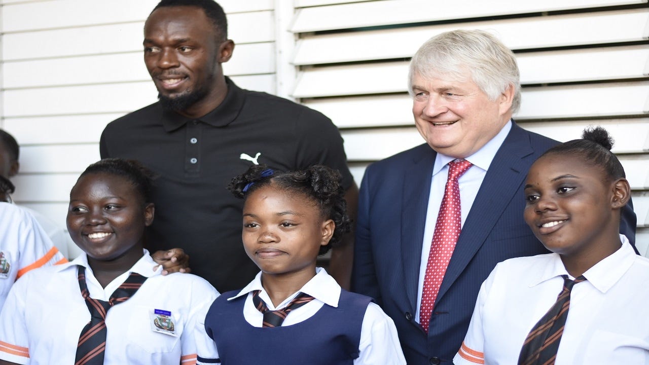 Denis O’Brien and Usain Bolt at Tivoli Gardens Comprehensive High School