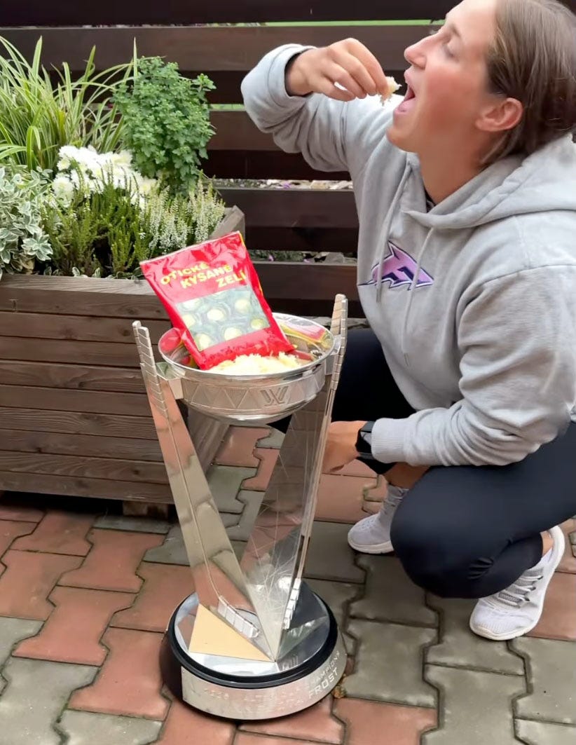Klara Hymlarova eating cabbage out of the Walter Cup.