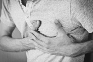 Man clutching his chest