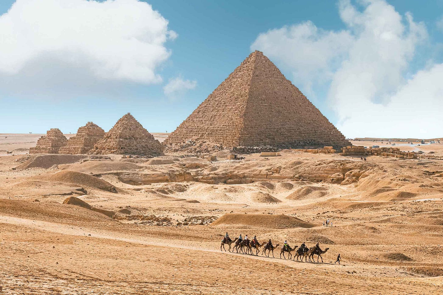 Egyptian pyramids with camel group in foreground Egyptian pyramids with camel group in foreground