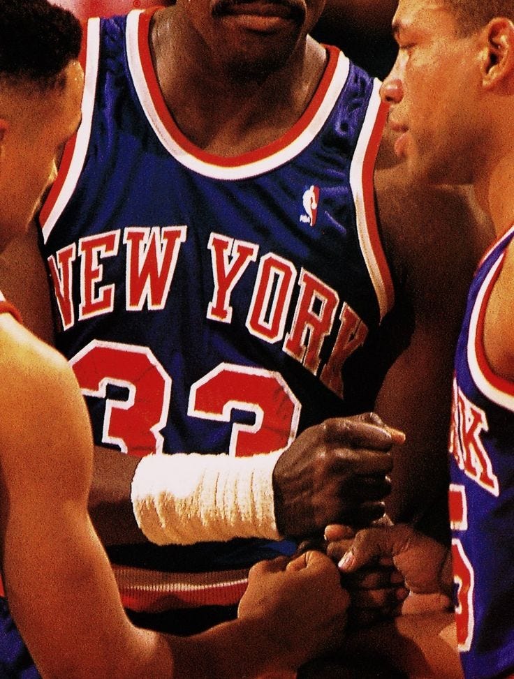 This may contain: the new york basketball team is talking to each other in a huddle during a game