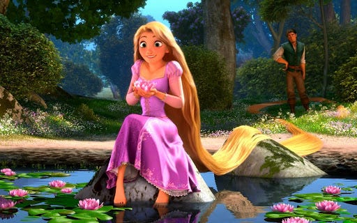 Still from the movie Tangled with Rapunzel sitting on a rock in a pond, holding a lily. Flynn Rider looks on from the background.