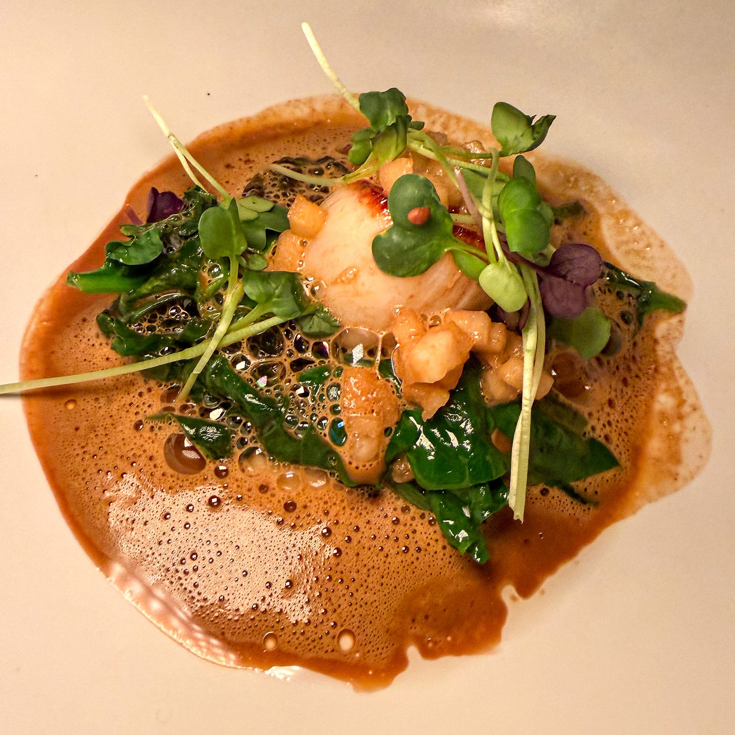 Scallops with lobster-coconut bisque at Fugue, Paris