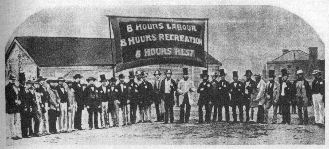 Striking workers with an 8-hour day sign. Striking workers with an 8-hour day sign.