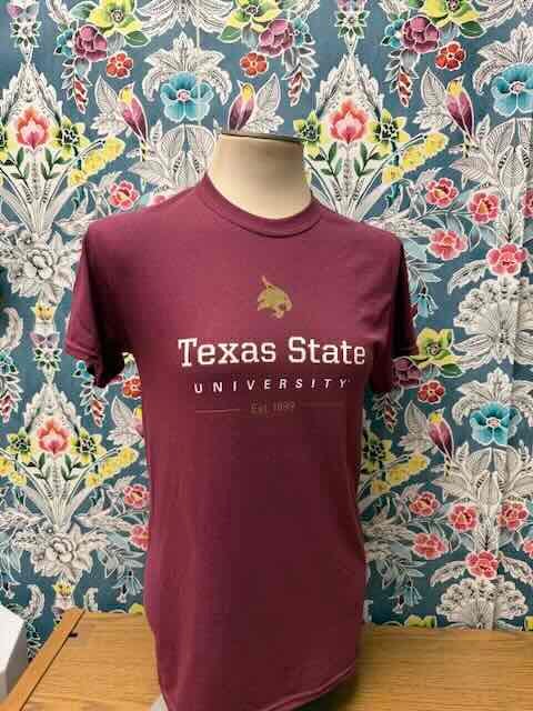 Mannequin wearing Texas State University t-shirt positioned outside office door Mannequin wearing Texas State University t-shirt positioned outside office door