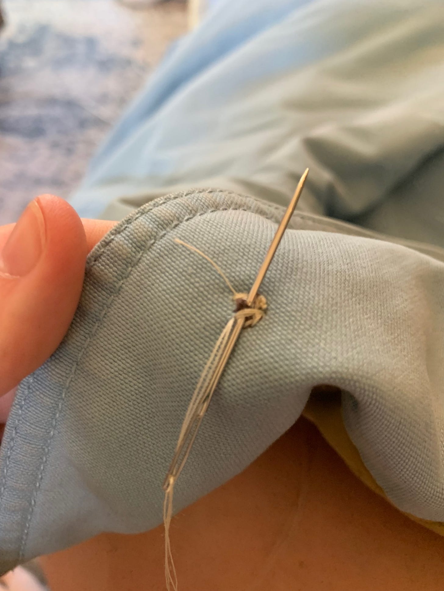 securingt he back of a recently attached button