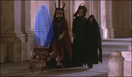 still from the phantom menace with two alien guys and a hologram