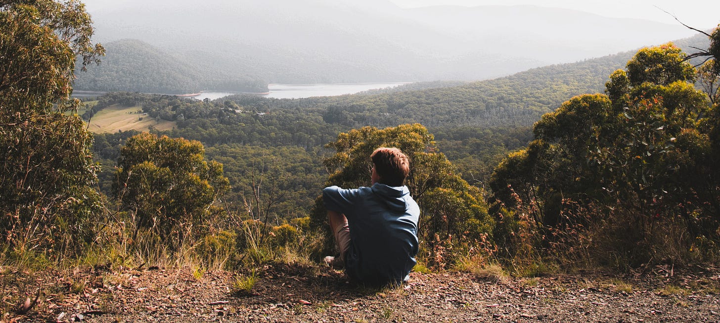 man sitting over valley, michelle cowles