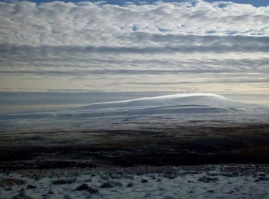 Photo of Cross Fell (Cumbria), showing the characteristic "comet tail" of cloud streaming off the top of the mountain due to the Helm wind.