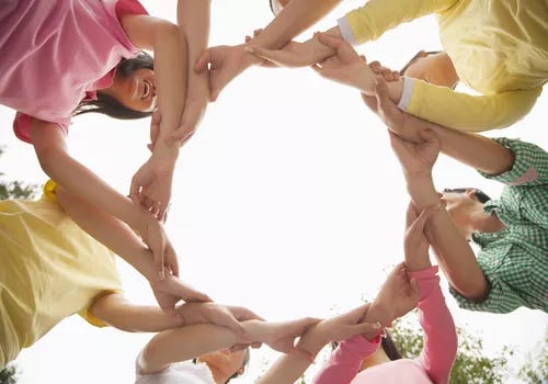 group of kids linking arms in a circle group of kids linking arms in a circle