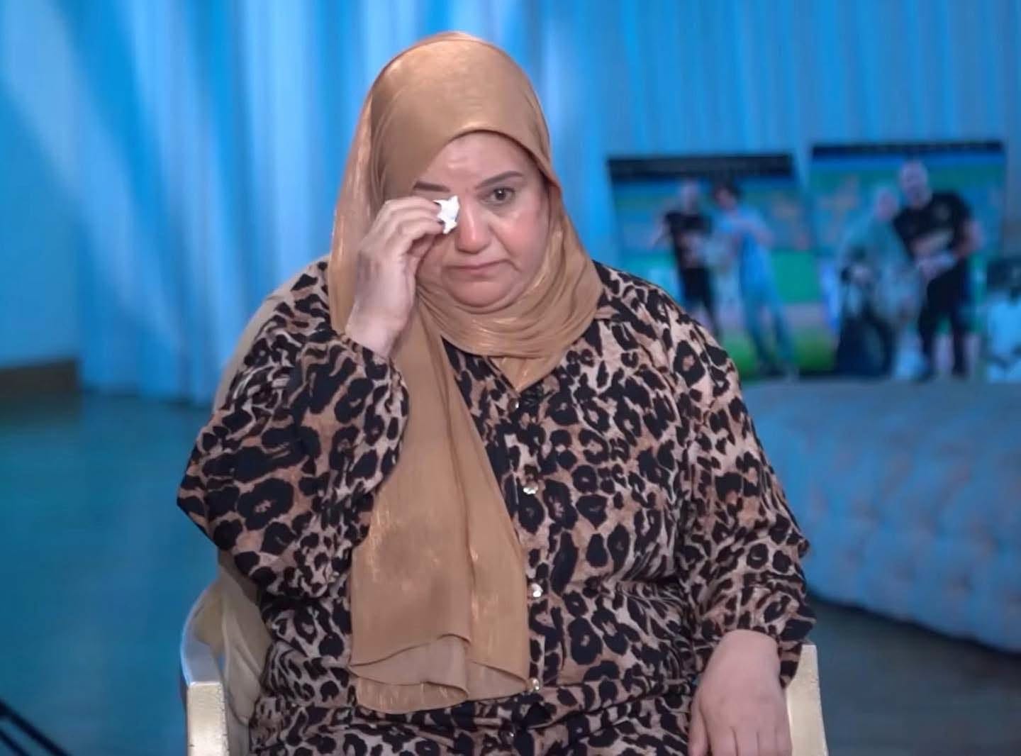 May be an image of one or more people, headscarf, television and newsroom
